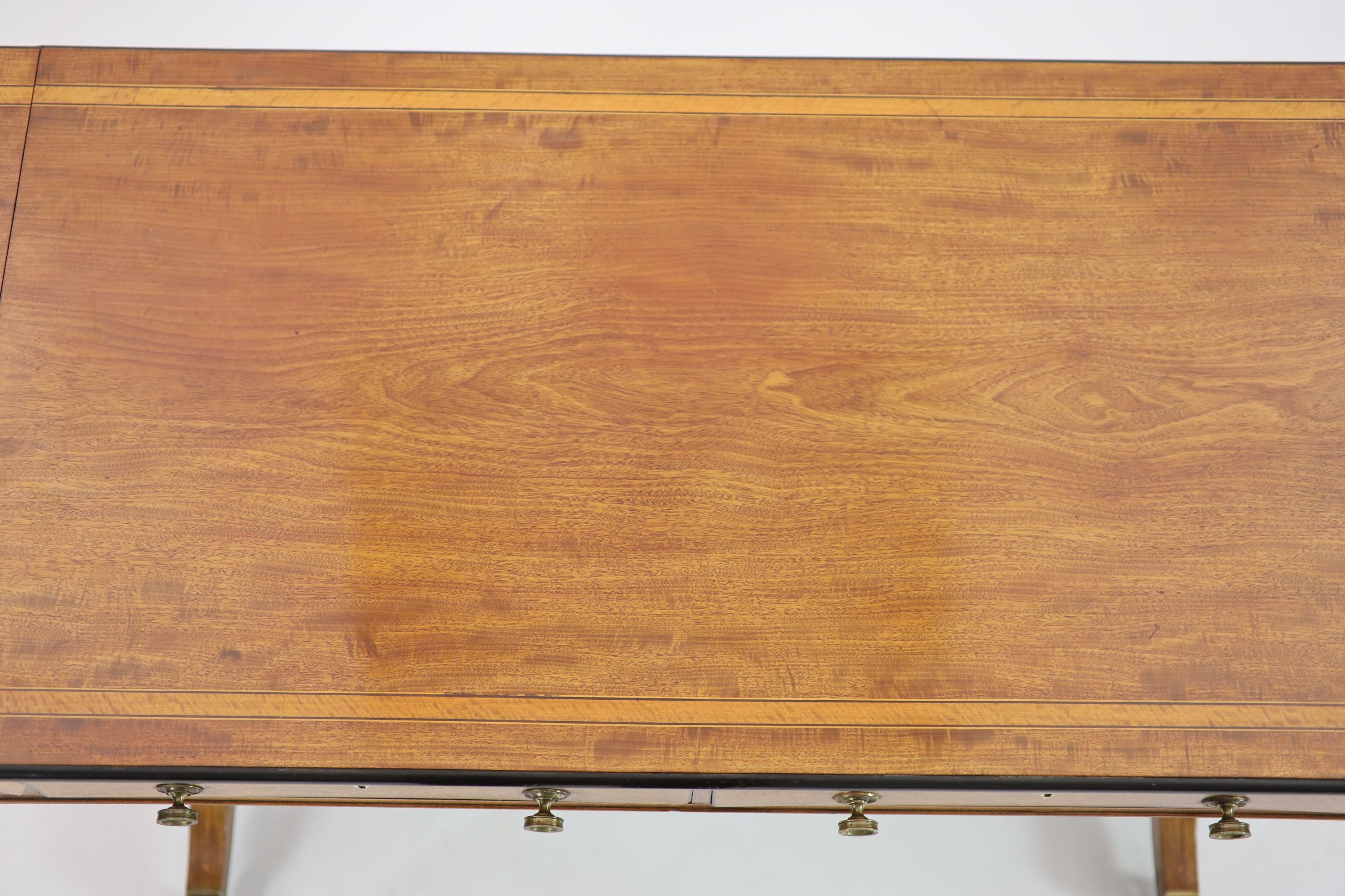A late George III satinwood banded mahogany sofa table, W.108cm D.59cm H.74cm